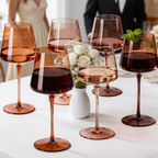 Venus Brown Wine Glasses — Set of 6: Close-up of brown wine glasses and a wine bottle.