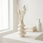 Stacked Bubble Gypsum Vase — White, 5 in: Bubble vase holding dried stems on a shelf.
